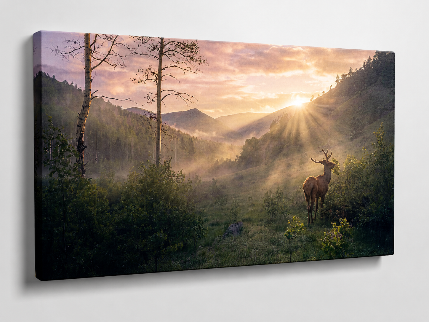 3D gallery wrapped canvas mockup of Deer in Mountain Meadow Wall Art featuring a deer overlooking a golden mountain valley at sunrise.