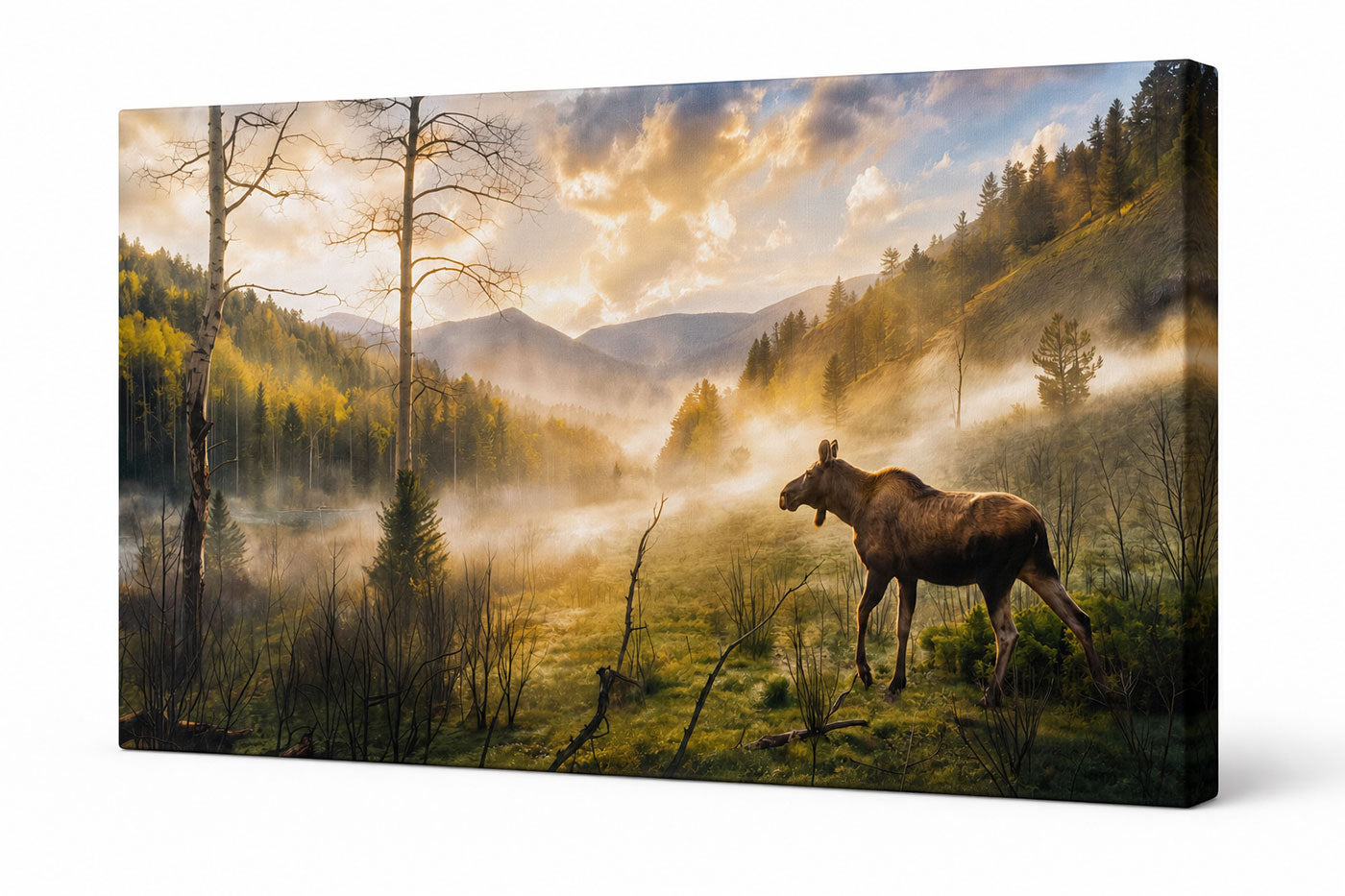 A rectangular wall art canvas showing a misty mountain valley with trees and a moose in the foreground, photographed at an angle against a plain white background.