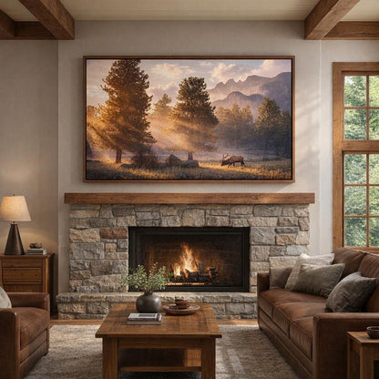 Panoramic elk wall art in an oak frame above a cream sofa with soft window light in a bright mountain cabin