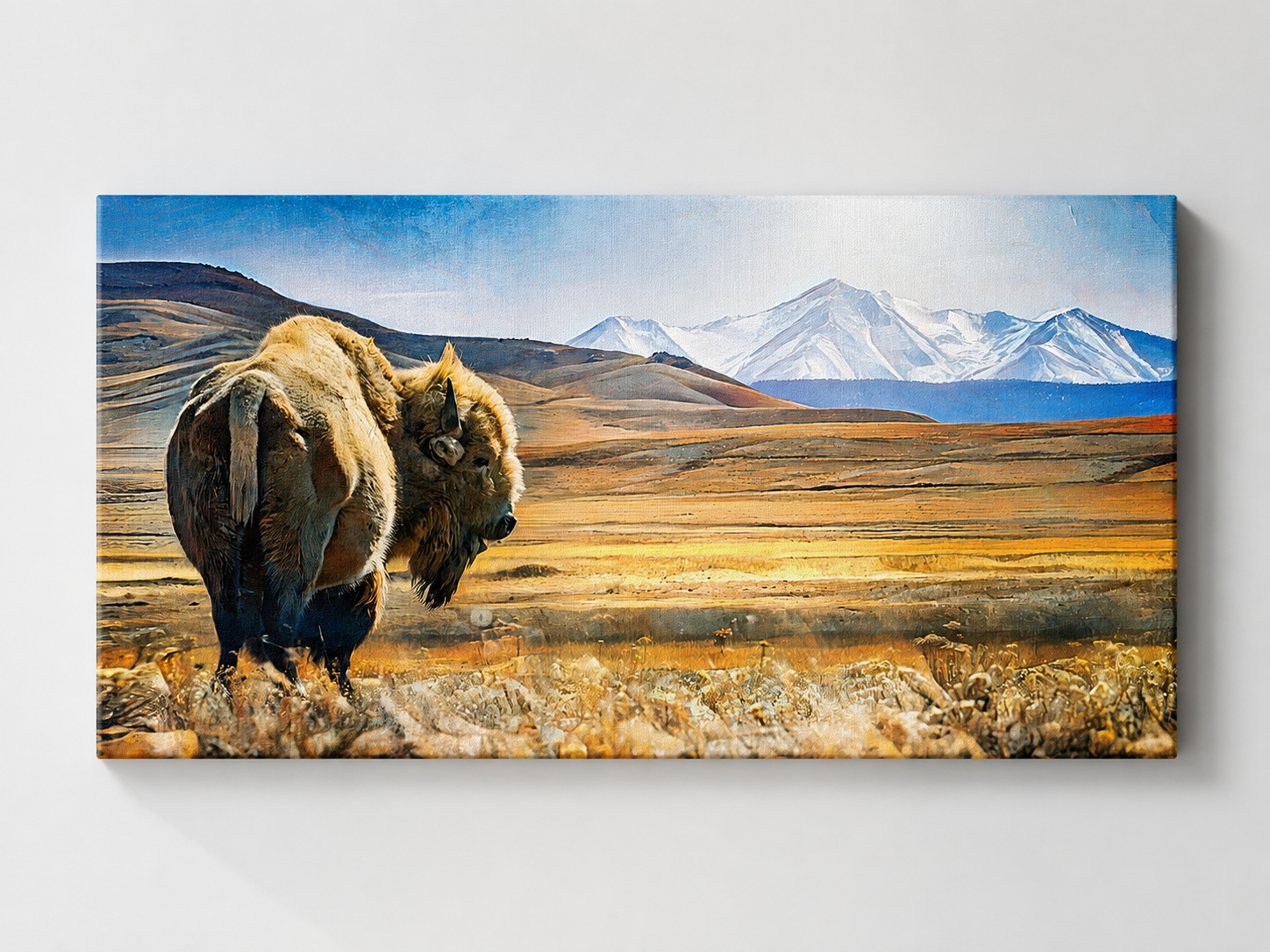 Solitary bison mountain wall art displayed as a thin premium gallery-wrapped canvas mockup