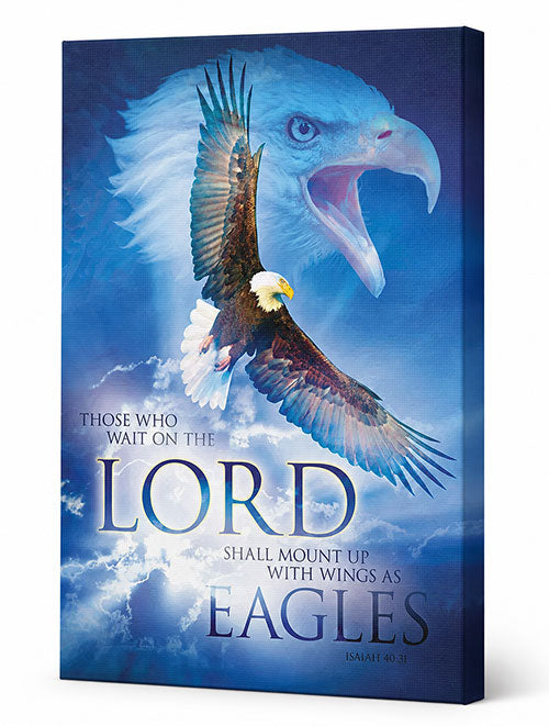 A vertical canvas wall art print featuring a dramatic blue sky background with a large bald eagle head in the upper right, a real bald eagle flying through the center, and the text 'THOSE WHO WAIT ON THE LORD SHALL MOUNT UP WITH WINGS AS EAGLES' plus 'ISAIAH 40:31'. The canvas is shown at a slight angle with a white studio background.